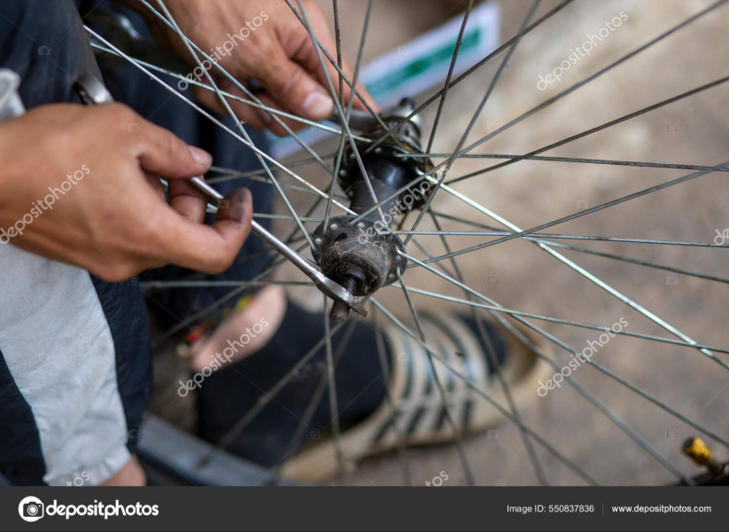 depositphotos-550837836-stock-photo-close-axle-bicycle-wheel-being